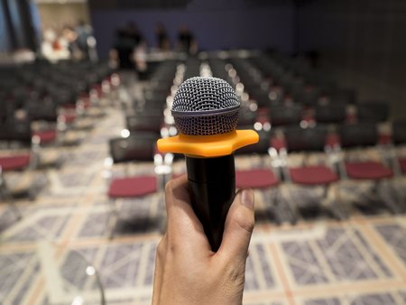 man with microphone at conference hallの写真素材