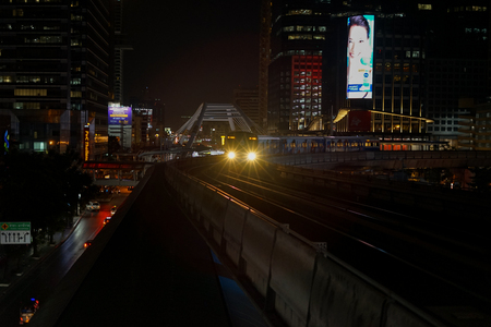 sky train arriving Chong Nonsi Station night timeの写真素材