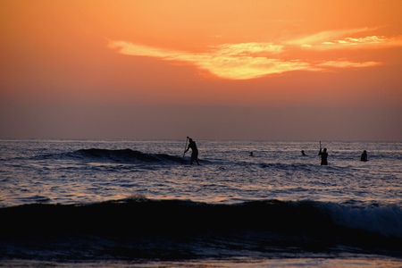 Paddle boarding at sunset on the Pacific