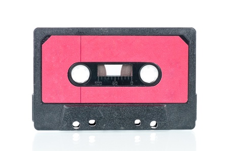 Cassette tape over a reflective white background