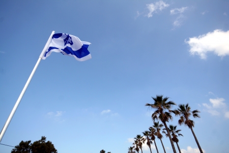 The flag of Israel flying in the breeze の写真素材