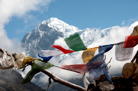 Buddhist flag in himalayan mountainsの写真素材