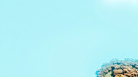 Underwater view of coral reef with blue sky and copy space.の写真素材