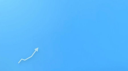 Highly rendering of an arrow on a blue background with copy spaceの写真素材