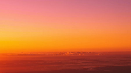 Cloudscape, View from the window of an airplane flying above the clouds at sunset.の写真素材