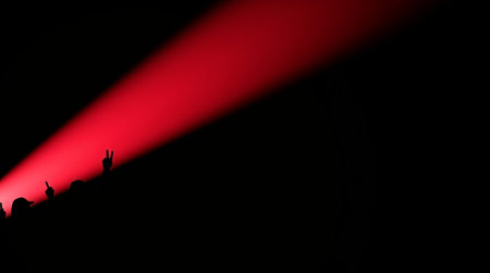 Stage Spotlight with People Silhouette and Red Light on Black Background