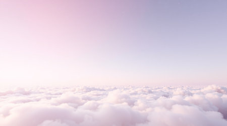 Beautiful aerial view above clouds with a pastel colored sky.