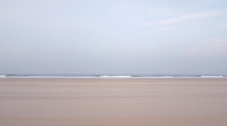 Beach in the morning light. Seascape with blue sky