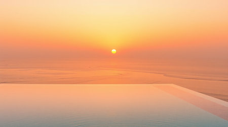 Sunrise on the beach with swimming pool and sea in the morning