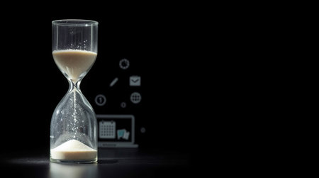 Hourglass on a black background. Concept of time management and time management.