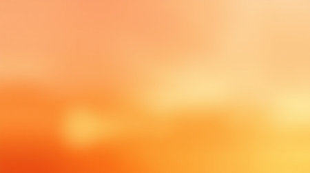 Abstract blurred orange and yellow gradient background with copy space for design.