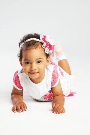 Lovely crawling little girlの写真素材