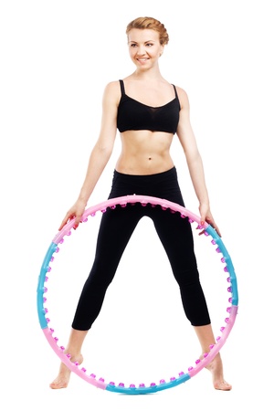 Beautiful sporty woman with  hoop isolated on white backgroundの写真素材