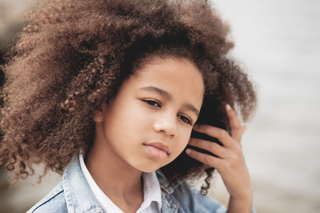 Outdoor portrait of a beautiful little girlの写真素材