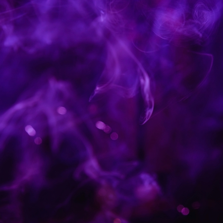 Beautiful ultra violet smoke. Blurred backgroundの写真素材