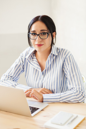 Lovely businesswoman at work の写真素材