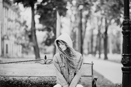 Black and white street style romantic portrait of a young beautiful womanの写真素材