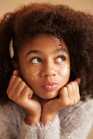 Portrait of cute beautiful girl with shiny makeupの写真素材