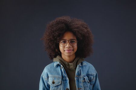 Studio portrait of cute girl wearing spectaclesの写真素材