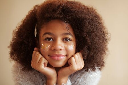 Portrait of cute beautiful girl with shiny makeupの写真素材