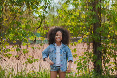 Little girl full of happines and excitement. Outdoor picture.の写真素材
