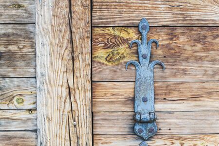 Fragment of wooden window shutters of wood house with vintage metal furniture, close up, horizontal...