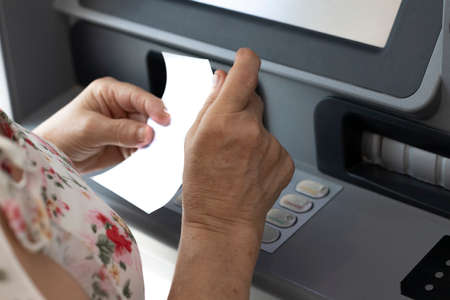 an ATM, at the customer's service to withdraw money. Finance conceptの写真素材