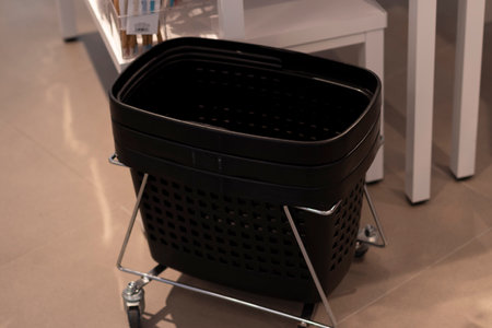 Closeup of a black plastic basket in a store.の写真素材