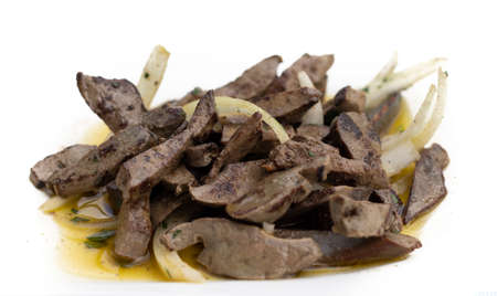 liver with onions, a typical food in Spain. Isolated on white. Healthy food concept (selective focus)の写真素材
