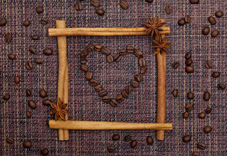 Heart of Coffee Beans in Cinnamon Sticks and Anise Stars Frameの写真素材