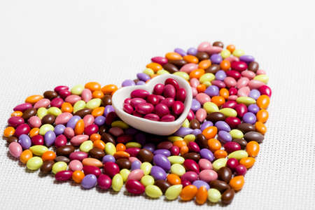 Colorful Glazed Candies Heart on White Backgroundの写真素材