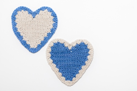 White Blue Crochet Knitted Hearts on White Backgroundの写真素材
