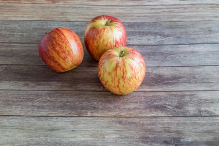 red apples on wooden background