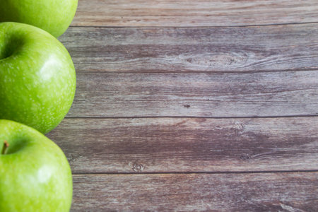 green apple on wooden backgroundの写真素材