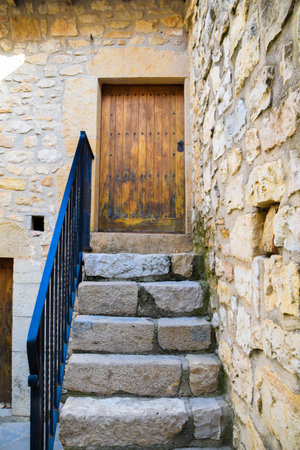Wooden door in a stone wall in a village in the province of Zamora, Spainの写真素材
