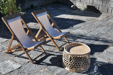 two chairs and basket under the sunshineの写真素材