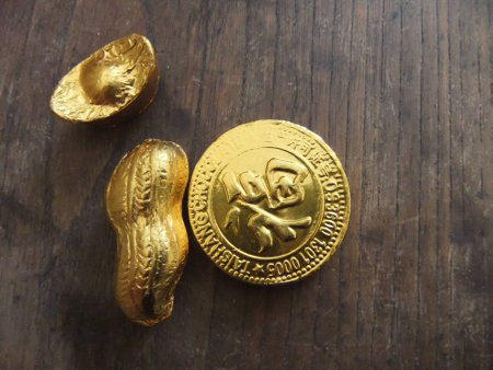 Gold coin, peanut and ingotの写真素材