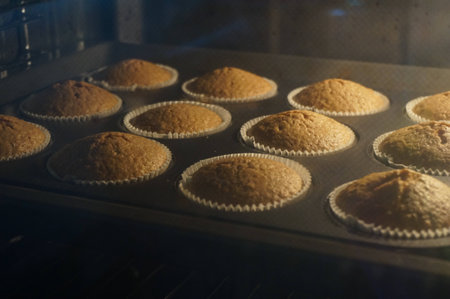 Cupcakes in the ovenの写真素材