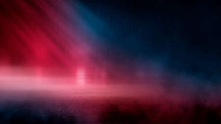 Neon futuristic landscape of a night street with neon light reflected in the water. Urban neon abstraction. Dark street wet asphalt reflections of rays.の写真素材