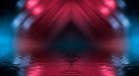 Neon futuristic landscape of a night street with neon light reflected in the water. Urban neon abstraction. Dark street wet asphalt reflections of rays.の写真素材