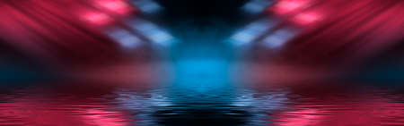 Neon futuristic landscape of a night street with neon light reflected in the water. Urban neon abstraction. Dark street wet asphalt reflections of rays.の写真素材