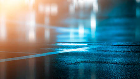 Dark street wet asphalt reflections of rays in the water Abstract dark blue background smoke smog Empty dark scene neon light spotlightsの写真素材