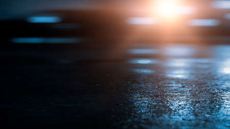 Dark street wet asphalt reflections of rays in the water Abstract dark blue background smoke smog Empty dark scene neon light spotlightsの写真素材
