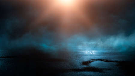 Dark street wet asphalt reflections of rays in the water Abstract dark blue background smoke smog Empty dark scene neon light spotlightsの写真素材