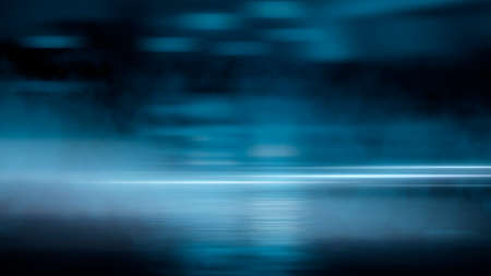 Dark street wet asphalt reflections of rays in the water Abstract dark blue background smoke smog Empty dark scene neon light spotlightsの写真素材