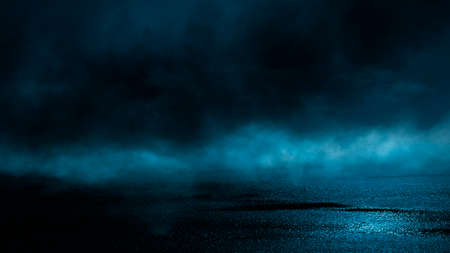 Dark street wet asphalt reflections of rays in the water Abstract dark blue background smoke smog Empty dark scene neon light spotlightsの写真素材