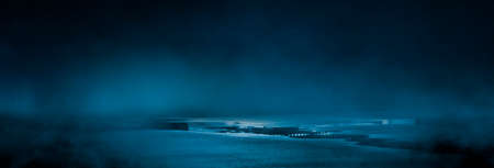 Dark street wet asphalt reflections of rays in the water Abstract dark blue background smoke smog Empty dark scene neon light spotlightsの写真素材