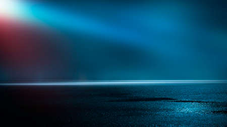 Dark street wet asphalt reflections of rays in the water Abstract dark blue background smoke smog Empty dark scene neon light spotlightsの写真素材