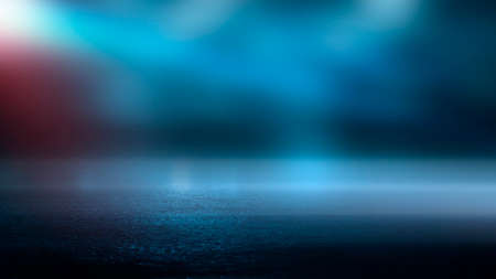 Dark street wet asphalt reflections of rays in the water Abstract dark blue background smoke smog Empty dark scene neon light spotlightsの写真素材