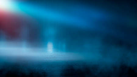 Dark street wet asphalt reflections of rays in the water Abstract dark blue background smoke smog Empty dark scene neon light spotlightsの写真素材